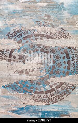 Ancient ornament and stylization of the sun on an old wall. Stock Photo