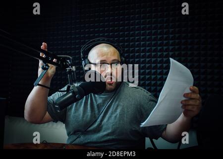 Talking male radio presenter in radio station Stock Photo
