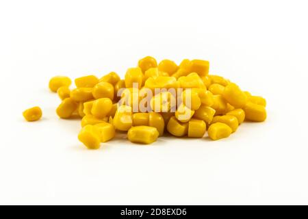 Handful of canned corn on white isolated background Stock Photo
