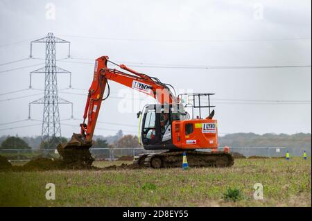 Aylesbury Vale, Buckinghamshire, UK. 28th October, 2020. HS2 at work near Grim's Ditch. A viaduct is going through the valley and ancient woodland for the High Speed 2 rail link from London to Birmingham. The hugely controversial HS2 construction puts 108 ancient woodlands, 33 SSSIs and 693 wildlife sites at risk. Credit: Maureen McLean/Alamy Stock Photo