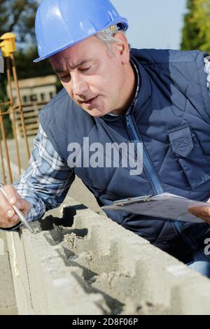 man builder working with cement Stock Photo