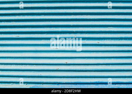 Old weathered rusty grunge corrugated blue painted sheet metal Stock Photo