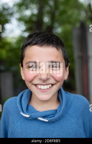 Closeup portrait of a young smiling boy in Gori, Georgia, Caucasus, Eastern Europe. Stock Photo