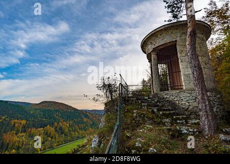Viewpoint at the temple of the military cemetery in the Danube valley near Beuron in autumn with a view of the monastery and the colorful valley Stock Photo