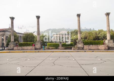 Main street of the Central Park of Quetzaltenango Guatemala early in the morning -park in a colonial city on a cold morning. Stock Photo
