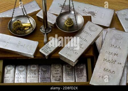 Homestake Mining Company silver bullion bars. Now closed mine located at Lead, South Dakota - Black Hills, USA. Gold bar and nuggets on balance scale. Stock Photo