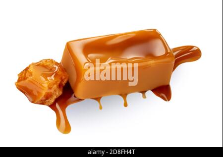 Soft caramel isolated on a white background. Salted melted toffee candy with caramel sauce, top view Stock Photo