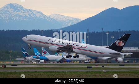 Richmond, British Columbia, Canada. 11th May, 2020. A Cargojet Airways Boeing 767-300ER (C-GUAJ) cargo jet takes off from Vancouver International Airport. Credit: Bayne Stanley/ZUMA Wire/Alamy Live News Stock Photo