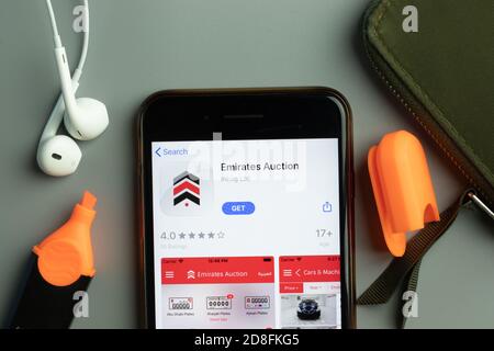 New York, USA - 26 October 2020: Emirates Auction mobile app icon logo on phone screen close-up, Illustrative Editorial Stock Photo