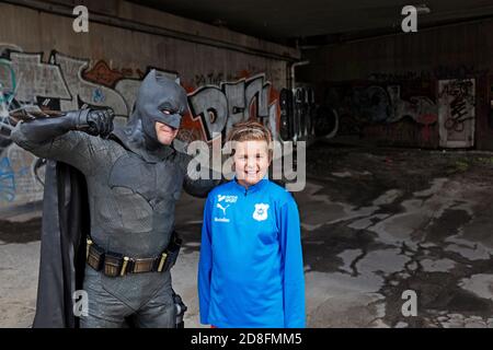 Umea, Norrland Sweden - September 5, 2020: youth are threatened by Batman Stock Photo