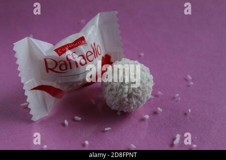 candy white and Raffaello lie together side by side on a fuchsia pink background with copy space free space for the product text Stock Photo