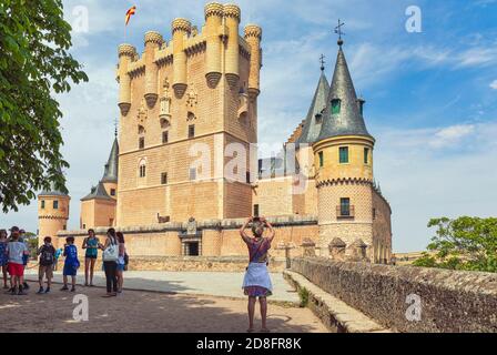 The Alcazar.  The central tower is the Tower of John II of Castile.  Segovia, Segovia Province, Castile and Leon, Spain.  The Old Town of Segovia and Stock Photo