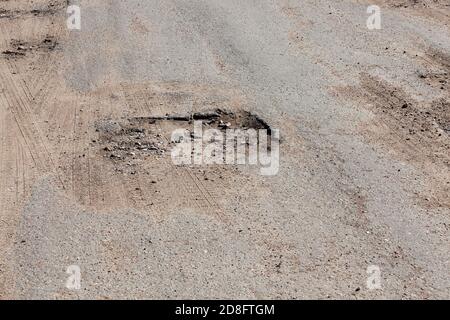 large holes and potholes Stock Photo