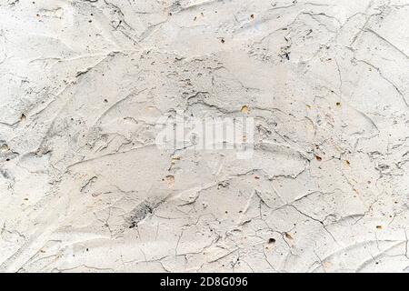 cement wall with cracks and scratches Stock Photo