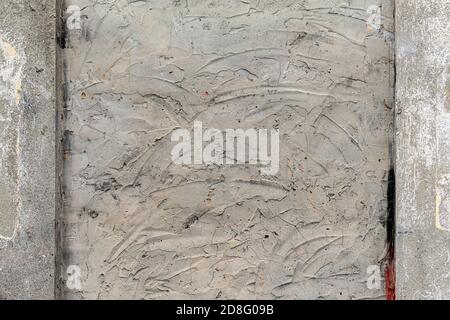 Cement wall frame with cracks and scratches. Embedded Cemented window. Grunge blank Stock Photo