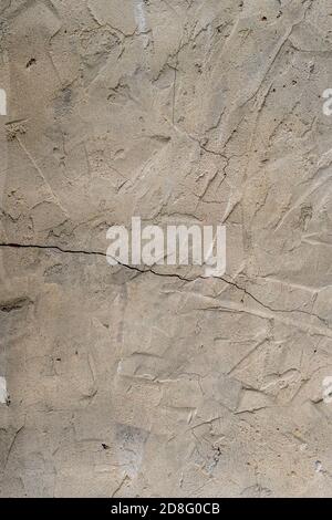 Cracks in the old plastered wall. Abstract background Stock Photo