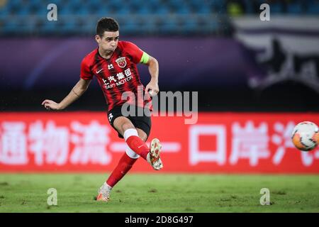 Brazilian football player Oscar dos Santos Emboaba Junior, better known as simply Oscar, of Shanghai SIPG F.C. shoots during the eighth-round match of Stock Photo