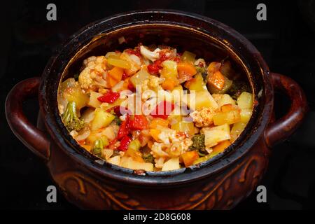 Close-up of a vegetable stew in a pot. Finely chopped various vegetables stewed in a saucepan. Healthy food concept Stock Photo