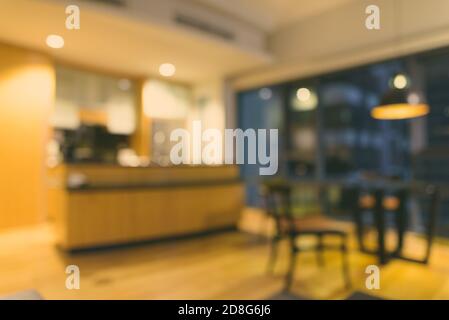 Blurred modern kitchen background with glass stand Stock Photo - Alamy