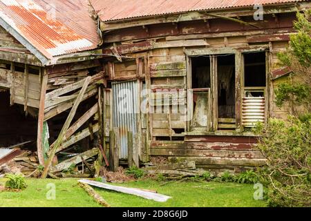 A long-abandoned, collapsing wooden and corrugated iron farmhouse. Photographed in New Zealand Stock Photo