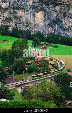 Train going through the Lauterbrunnen valley in Switzerland Stock Photo