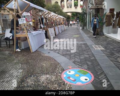 View of the manhole covers with cartoon paintings at Chengxi Street near Chongqing University in Chongqing, China, 25 September 2020. Stock Photo