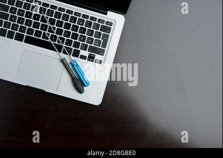 screwdriver and allen wrench, on wooden table. Technical support concept Stock Photo