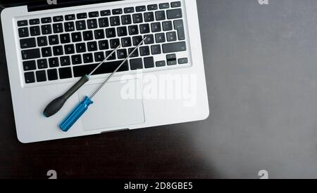 screwdriver and allen wrench, on wooden table. Technical support concept Stock Photo