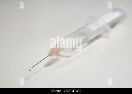 injection with corona, COVID-19 vaccine, extreme close up, free copy space, symbol picture Stock Photo