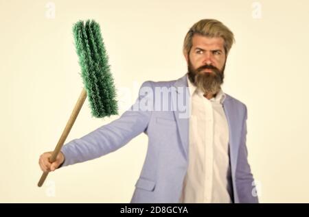 I agree to any work. Businessman hold broom. Financial crisis concept. Global crisis and unemployment. Qualified. Personnel shifts. New responsibilities. Demotion concept. Crisis and unemployment. Stock Photo