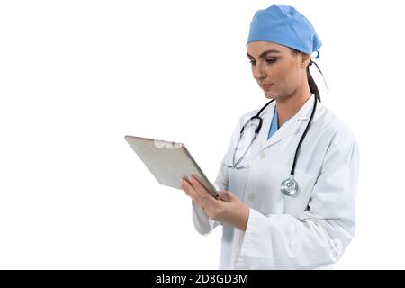 Female doctor using digital tablet against white background Stock Photo