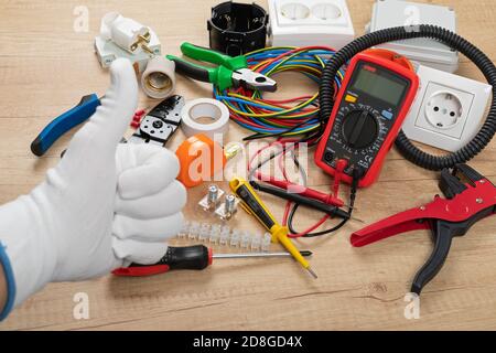 Tools for electrician needs: shocket multimeter, voltage testers, wire strippers, pliers, Stock Photo