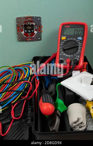 Tools for electrician needs: shocket multimeter, voltage testers, wire strippers, pliers, Stock Photo