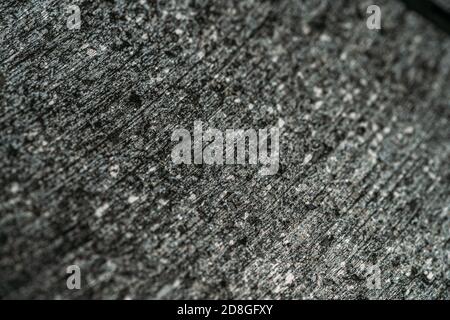 Rough textured gray surface metal or stone texture as background for design. Stock Photo