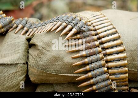 Vietnam war era M60 machine gun bullet belts on sandbags. Stock Photo