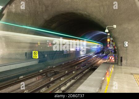 Motion blur of a train coming out of subway tunnel at Metro de Santiago, Santiago de Chile Stock Photo