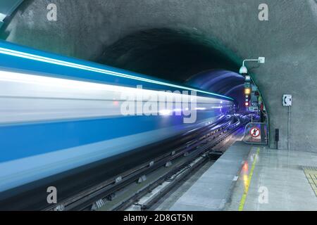 Motion blur of a train coming out of subway tunnel at Metro de Santiago, Santiago de Chile Stock Photo