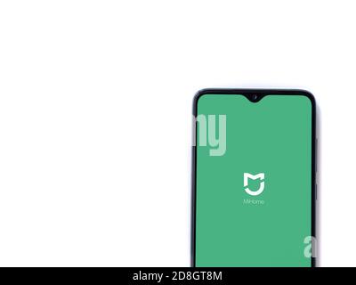 Lod, Israel - July 8, 2020: Mi Home app launch screen with logo on the display of a black mobile smartphone isolated on white background. Top view fla Stock Photo