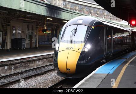 A GWR (Great Western Railway) train arrives at a platform at Bristol Temple Meads station in Bristol. Stock Photo