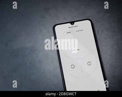 Lod, Israel - July 8, 2020: Roborock app launch screen with logo on the display of a black mobile smartphone on dark marble stone background. Top view Stock Photo