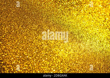 Flickering bright gold background. Bright gold or yellow texture. Stock Photo
