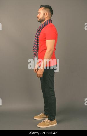 Young bearded Indian man against gray background Stock Photo