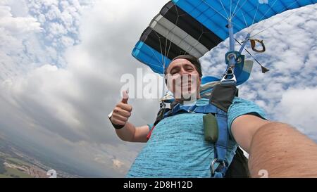 Skydiver making a selfie after the free fall Stock Photo