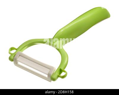 Green ceramic potato peeler photographed on a white background Stock Photo