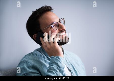 Male Man Talking On Mobile Phone Or Smartphone Stock Photo