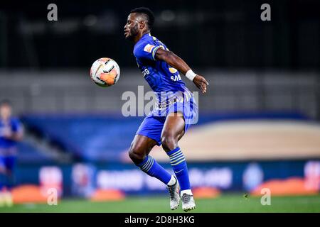 Ghanaian football player Mubarak Wakaso of Jiangsu Suning F.C. stops the ball during the eleventh-round match of 2020 Chinese Super League (CSL) again Stock Photo