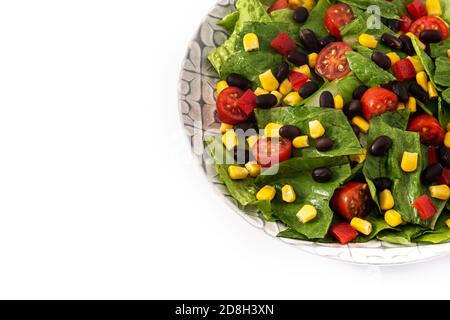 Mexican salad with black beans, corn,tomatoes,lettuce and pepper isolated on white background Stock Photo