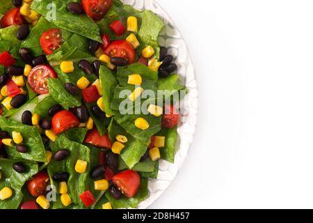 Mexican salad with black beans, corn,tomatoes,lettuce and pepper isolated on white background Stock Photo