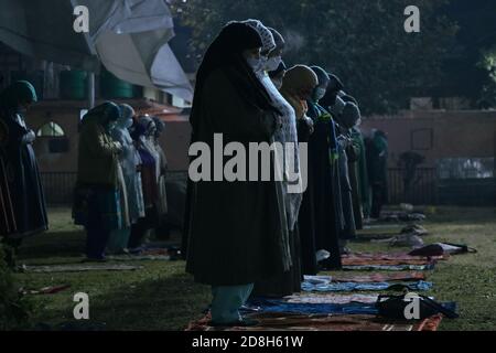 Srinagar, India. 30th Oct, 2020. Kashmiri Muslim women prays outside of Hazratbal Shrine during Eid-e-Milad the anniversary of the birth of the Prophet Mohammed in Srinagar, the summer capital of Indian administered Kashmir. (Photo by Adil Abass/Pacific Press) Credit: Pacific Press Media Production Corp./Alamy Live News Stock Photo