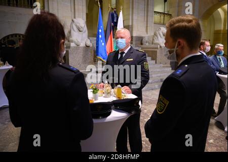 Dresden, Germany. 30th Oct, 2020. Horst Kretzschmar, State Police President, takes part in a ceremony for the last training course for the Saxonian guard police in the State Chancellery. Credit: Sebastian Kahnert/dpa-Zentralbild/ZB/dpa/Alamy Live News Stock Photo